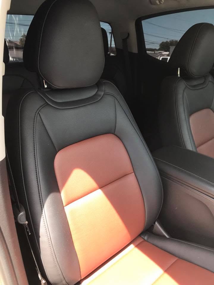 2015 Chevy Custom black and rust two-tone leather seats installed in a 2015 Chevrolet by Central Valley Upholstery