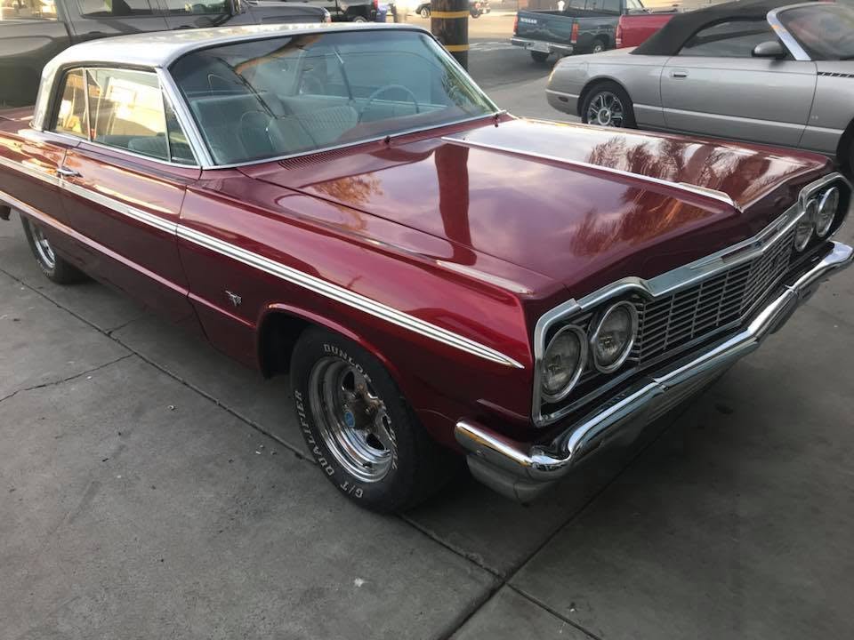 64 impala Restored maroon 1964 Chevrolet Impala with chrome trim and white vinyl top, custom upholstery by Central Valley Upholstery