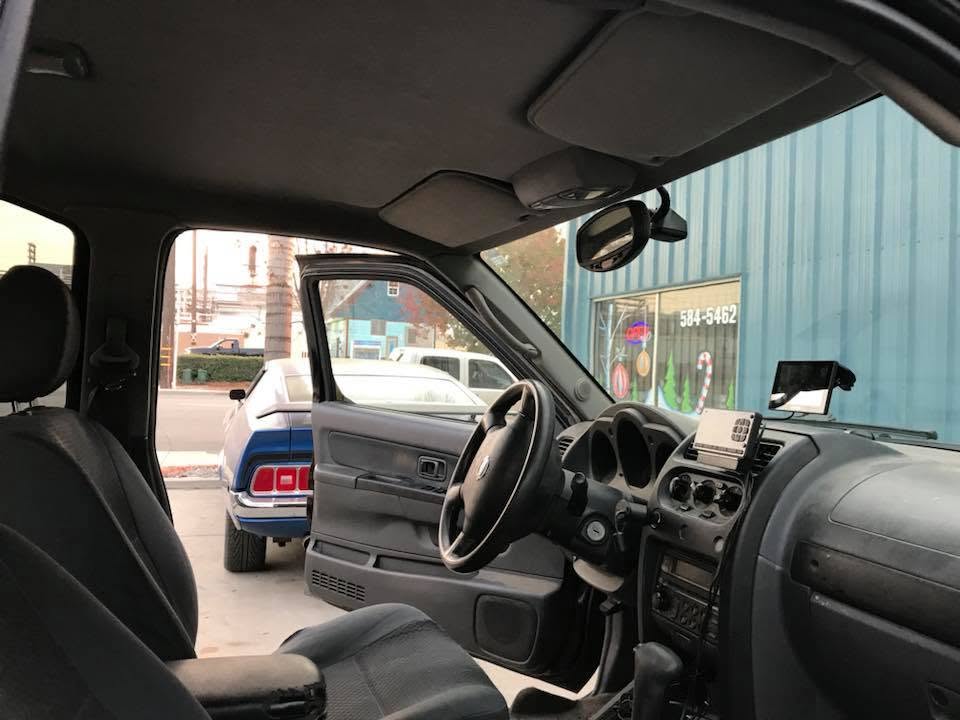 black car interior Custom black vinyl interior and door panels installed in a pickup truck by Central Valley Upholstery