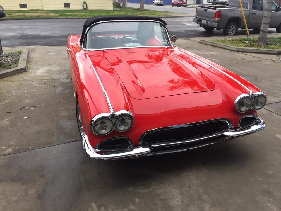 front of red convertible car<br />
