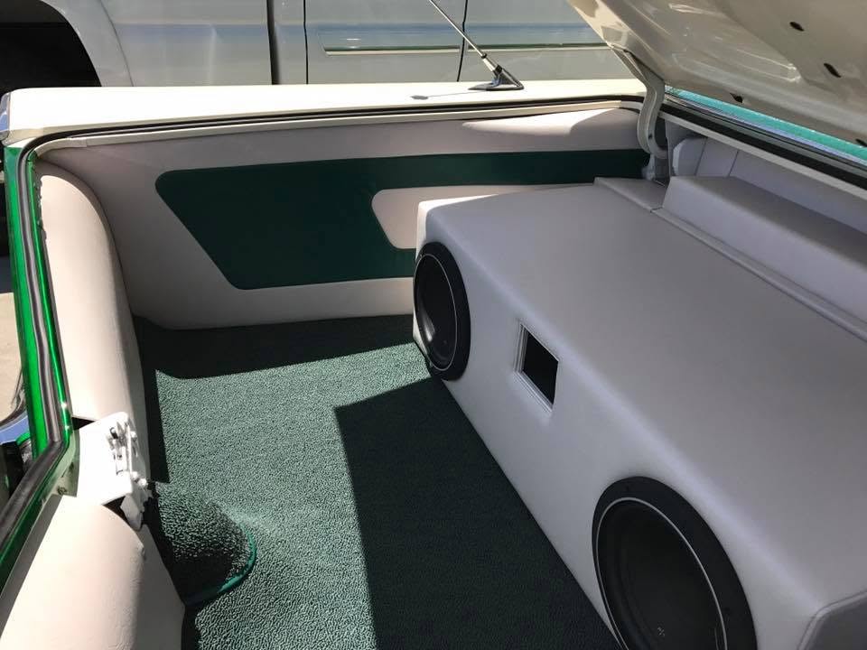 speakers Custom white vinyl trunk upholstery with built-in subwoofer enclosure in a classic Chevrolet by Central Valley Upholstery