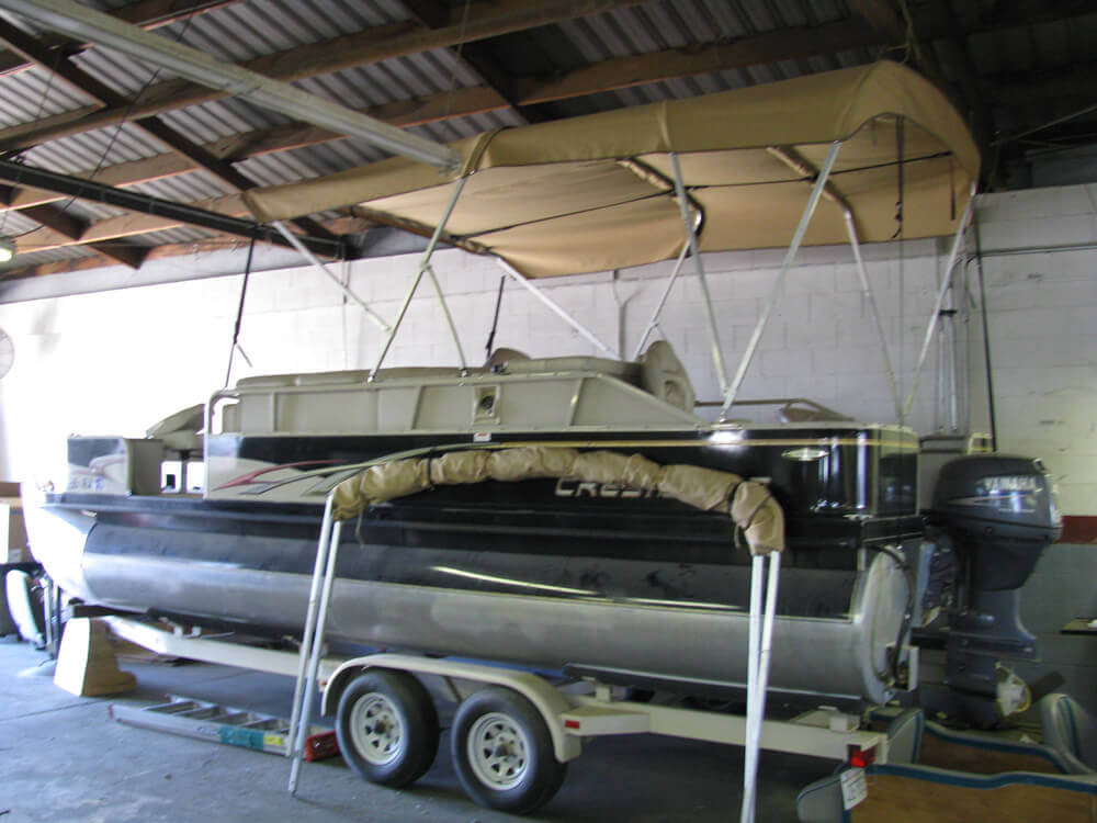 boat upholstery (14) Custom tan canvas bimini top installed on a pontoon boat by Central Valley Upholstery