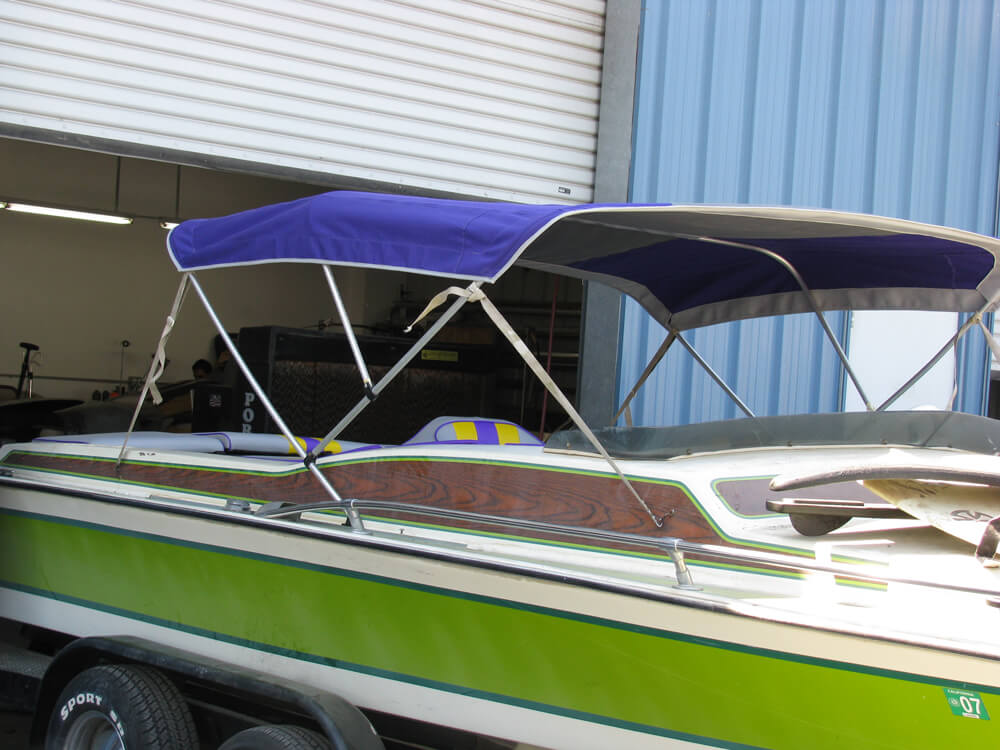 boat upholstery (2) Custom purple canvas bimini top installed on a boat by Central Valley Upholstery