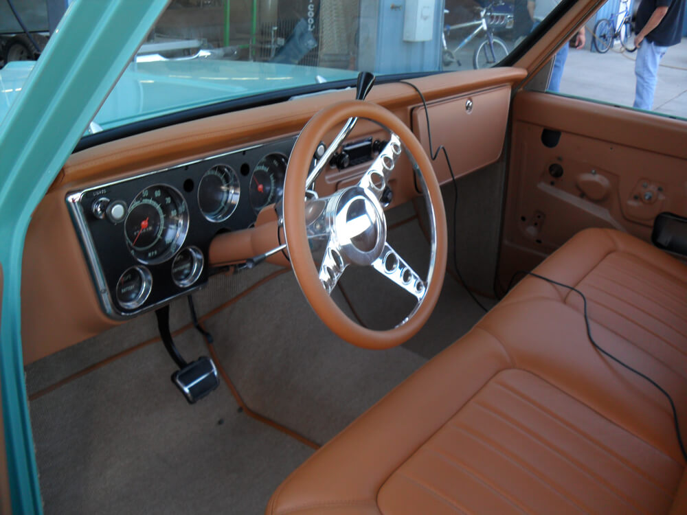 car seats (2) Custom tan leather dashboard, steering wheel, and bench seat in a classic Chevrolet C10 pickup truck by Central Valley Upholstery