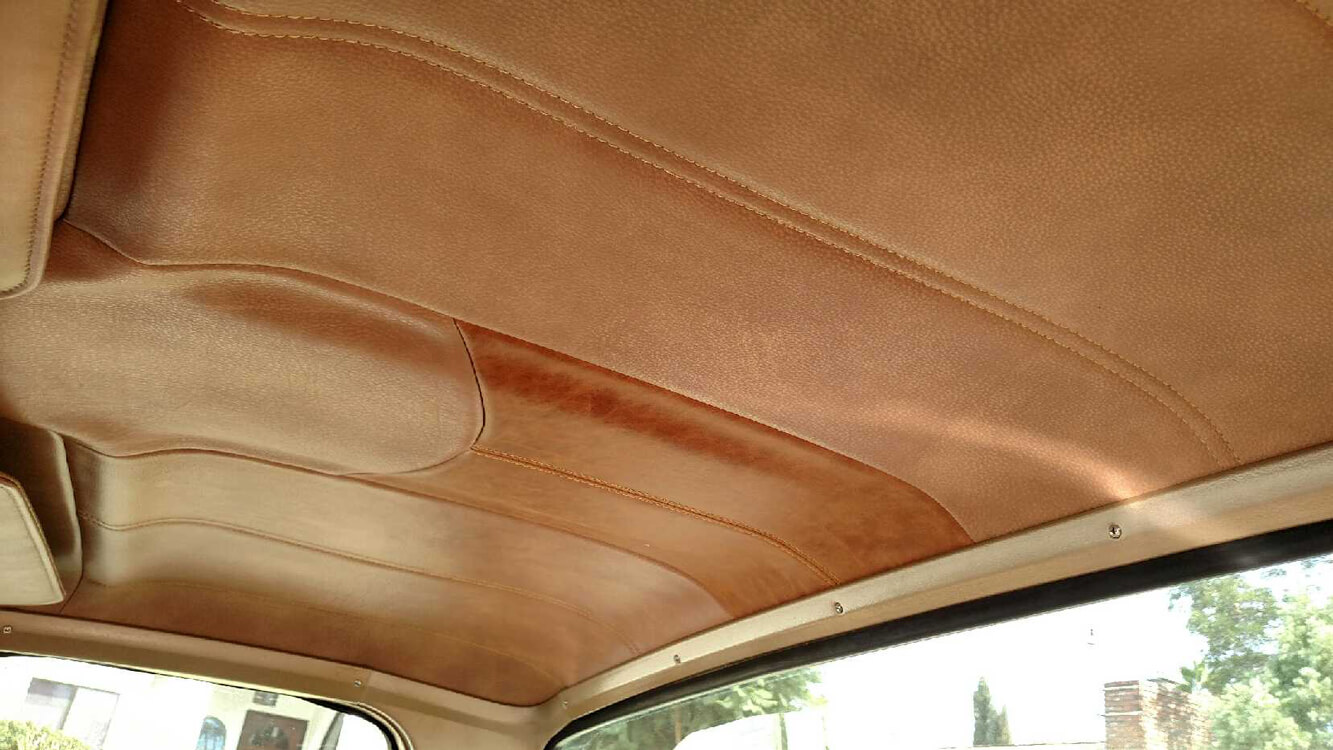 car seats (5) Custom tan leather headliner with contrast stitching installed in a classic car by Central Valley Upholstery